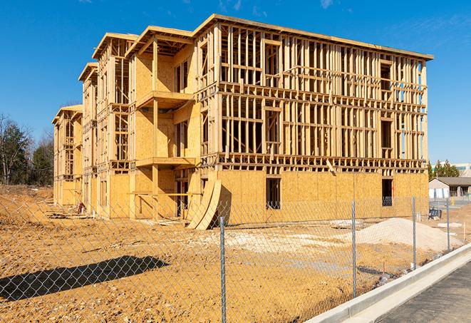 a temporary chain link fence in front of a building under construction, ensuring public safety in Moorpark